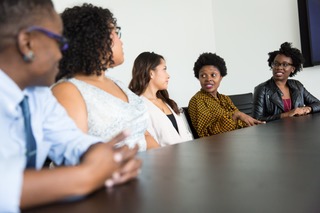 Employees sitting at a conference table